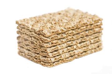 Stack of crispbread with sesame isolated on white