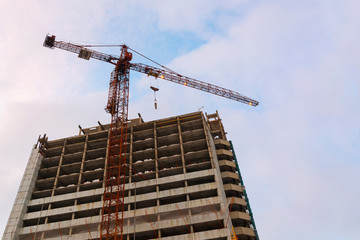Building of building with crane. Crane and Building Construction Site