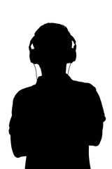 silhouette of teenager listening to music in headphones, man folded his arms on the chest on white isolated background