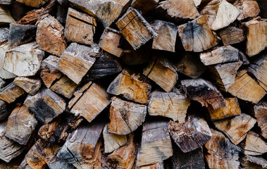 Firewood for the winter, stacks of firewood, pile of firewood.