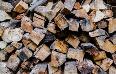 Firewood for the winter, stacks of firewood, pile of firewood.