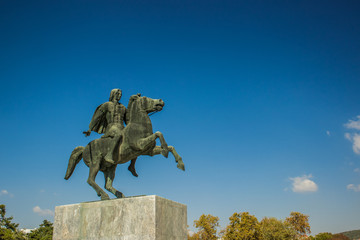 Alexander the great sculpture in Greece city on empty blue sky background