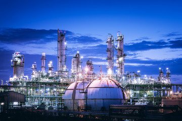 Gas storage sphere tanks in petrochemical plant with twilight sky background, Glitter lighting of industrial plant, Manufacturing of vinyl chloride monomer plant - obrazy, fototapety, plakaty
