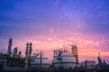 Industrial plant with gas product storage tanks on sunset sky background, Petrochemical plant