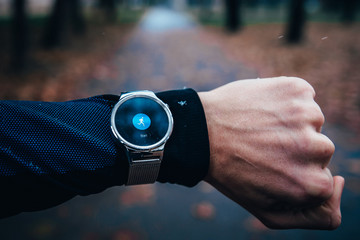 Sport modern watch, icon of running man on display.