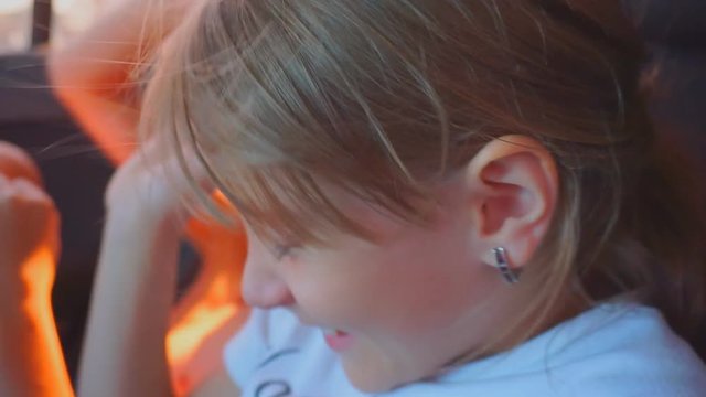 Children play in the back seat of a car. Little brother and sister - hooligans in the car. 1920X1080 Full Hd.