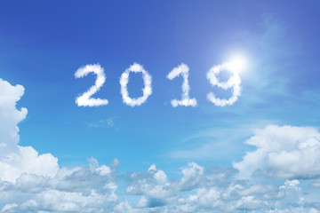 Naklejka na ściany i meble background of clear blue sky with 2019 clouds