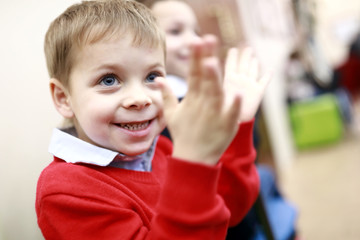 Kid applauds at concert
