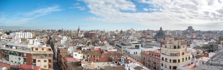 Fototapeta na wymiar A landscape of Valencia as seen from the Torres de Serrans (Serranos Gate) during a sunny winter day with blue sky and clouds, Spain