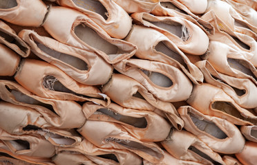 Old dirty pink ragged women ballet flat shoes. Ballet pointes in diagonal view.