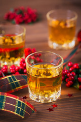Whiskey, brandy or liquor shot and Christmas decorations