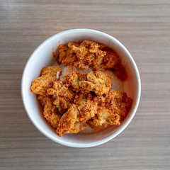 spicy pieces of chicken served with mixed rice.
