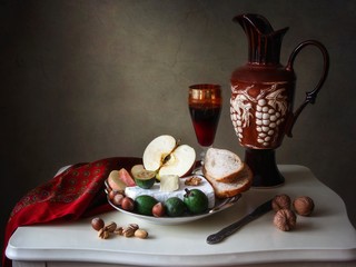 Still life with red wine and brie cheese