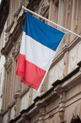 closeup of french flag on building facade in Strasbourg