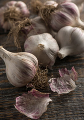 Close-up natural organic vegetable garlic on a wooden background, copy space.