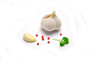 garlic and sprig parsley pepper on white background 