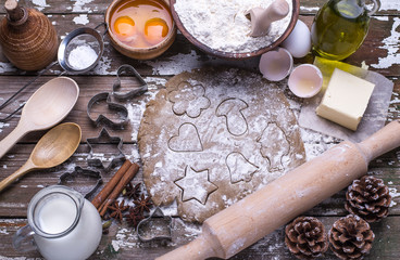 Set of natural products for baking homemade cookies - flour, butter, sugar, spices on a wooden background with copy space. Top view.