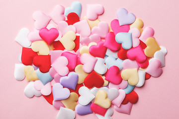 Heap of handmade colorful fabric hearts, valentine's day card, top view