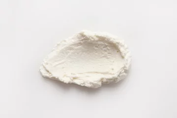 Foto op Canvas Smear of tasty cream cheese on white background, top view © New Africa