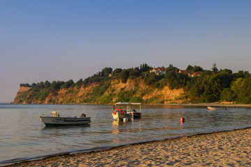 Sea and umbrellas on the beach in Greece