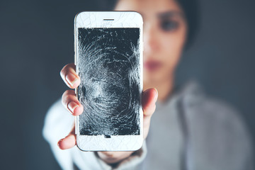 woman hand broken phone