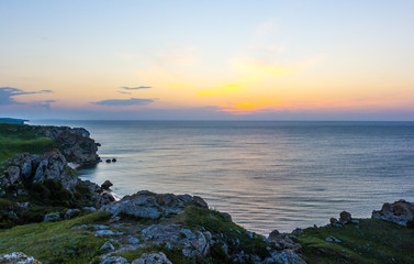 Beautiful sunset landscape over the sea coast. Sunset over the sea of Azov in Crimea.