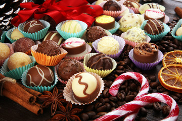 a lot of variety chocolate pralines, belgian confectionery gourmet chocolate and christmas spices with apples