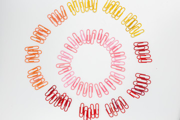 Multi-colored spiral figure made from paper clips isolated on white background.top view.
