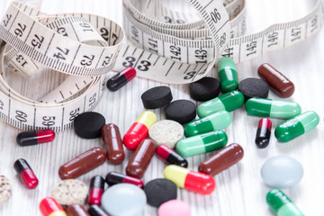 centimeter and pills, closeup