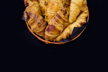 Buns with raisins on a black background