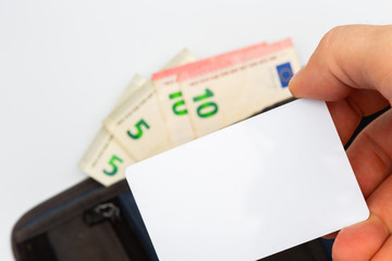 gray wallet with euro banknotes and blank credit card template for your text on white background