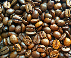 Roasted brown coffee beans texture background. Сlose up pattern photography