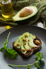Rye bread with avocado and mustard seeds