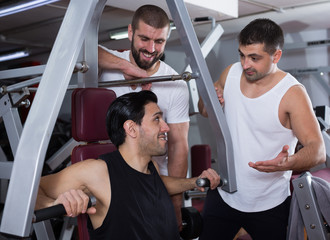 Three male friends in gym