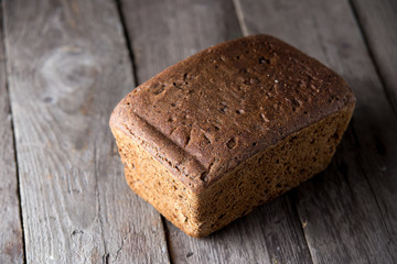 Healthy bread on old wooden background