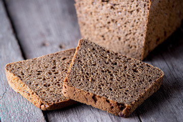 Healthy bread on old wooden background