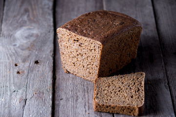 Healthy bread on old wooden background