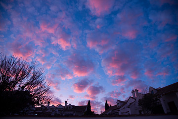 urban silhouette and skies with cirrocumulus clouds at dusk, © imago1956rs