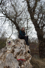 Woman and dog enjoying in the nature
