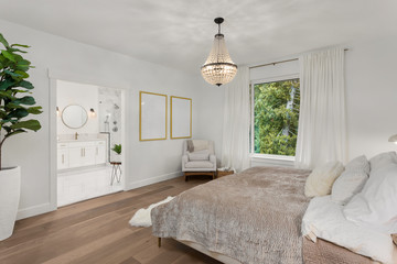 Beautiful Bedroom in New Luxury Home with View of Master Bathroom. Features Hardwood Floors and...