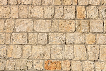 Vintage grunge stone blocks wall texture.