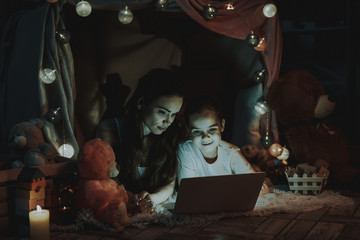 Mother and Daughter Using a Laptop