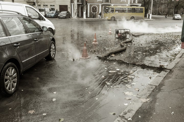 Odessa, Ukraine- Nov. 28, 2018: Accident on heating main. Burst pipes with hot water. Winter cold...