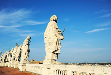 Apostles statues on the roof of St Peter's Basilica in Vatican city, (Rome, Italy).