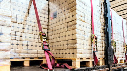  There is a loading to the truck trailer .  fastening of freight in the trailer .   transportation...