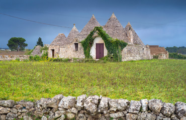 alone trulli house in Puglia region in Italy