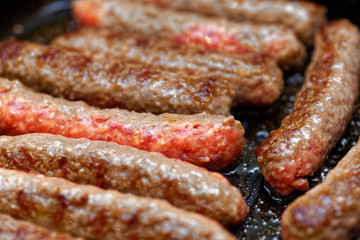 Close up grilled homemade meat sausages. Shallow depth a field
