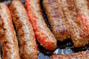 Close up grilled homemade meat sausages. Shallow depth a field