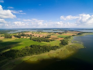 Fototapeta na wymiar Aerial view of beautiful landscape of lake district, Mamry Lake in the foreground, Swiecajty Lake in the background, Mazury, Poland