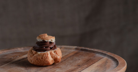 Still life with cakes. On a wooden plate